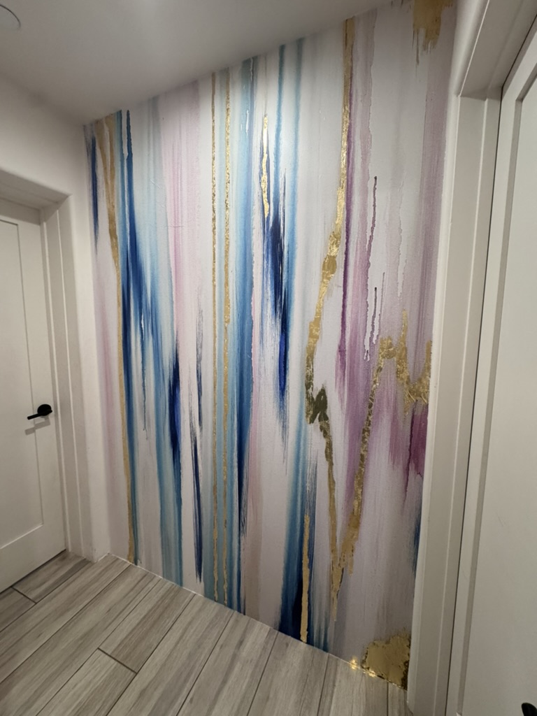 Hallway wall with a Vivian Ferne watercolor mural and gold leaf accents
